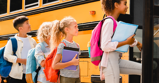 Kids boarding a school bus 